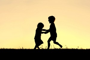 Children playing - sunset - shutterstock_196564262